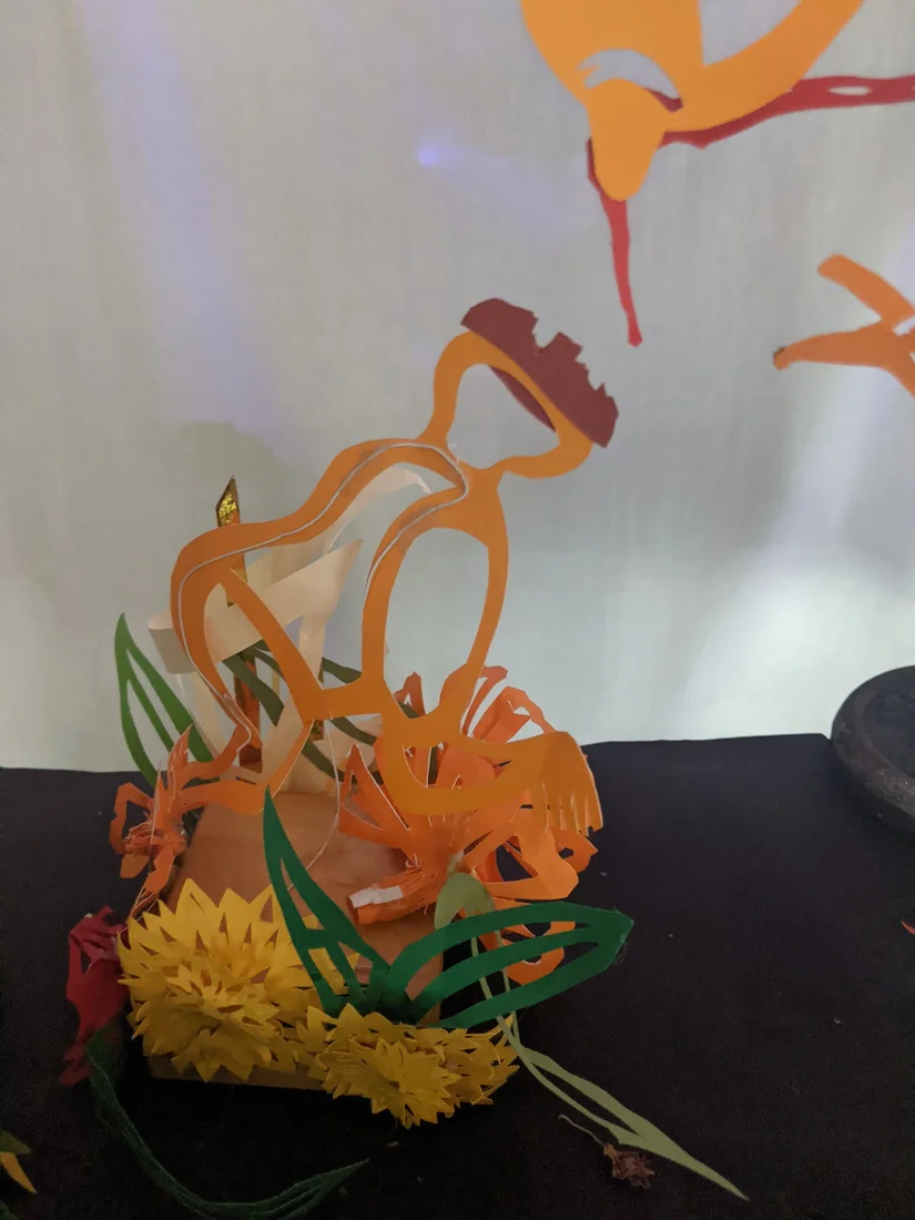 Colorful paper cut-outs and shadow puppetry by René Linares